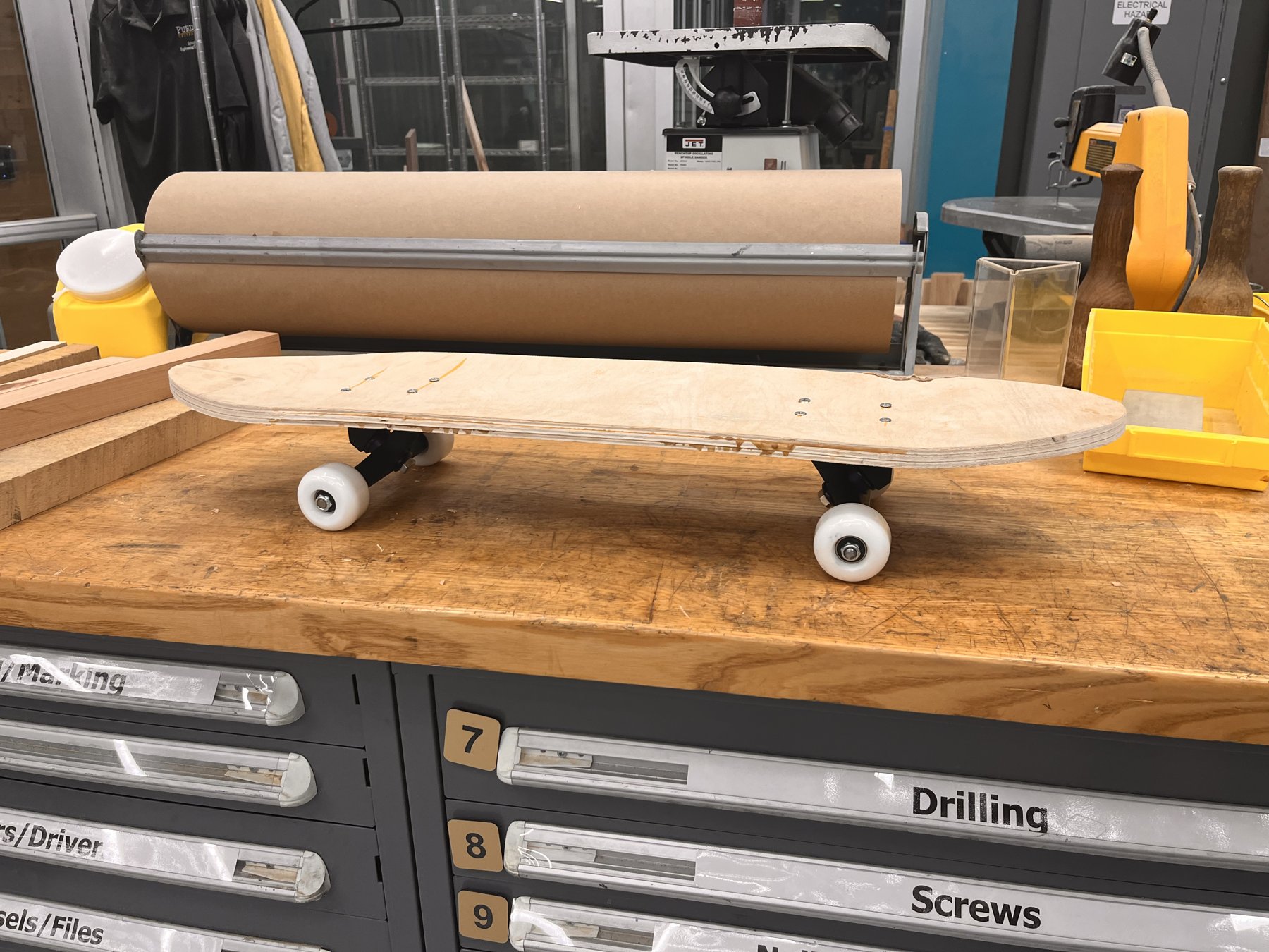 Full-size plywood prototype assembled with trucks and wheels