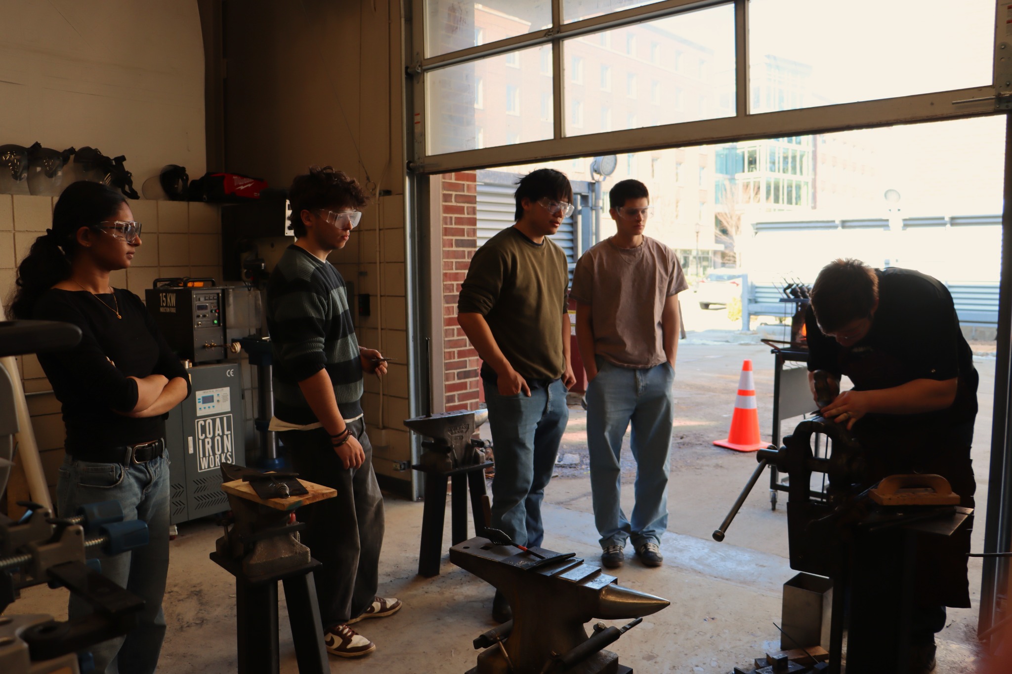 Students watching a blacksmithing demonstration