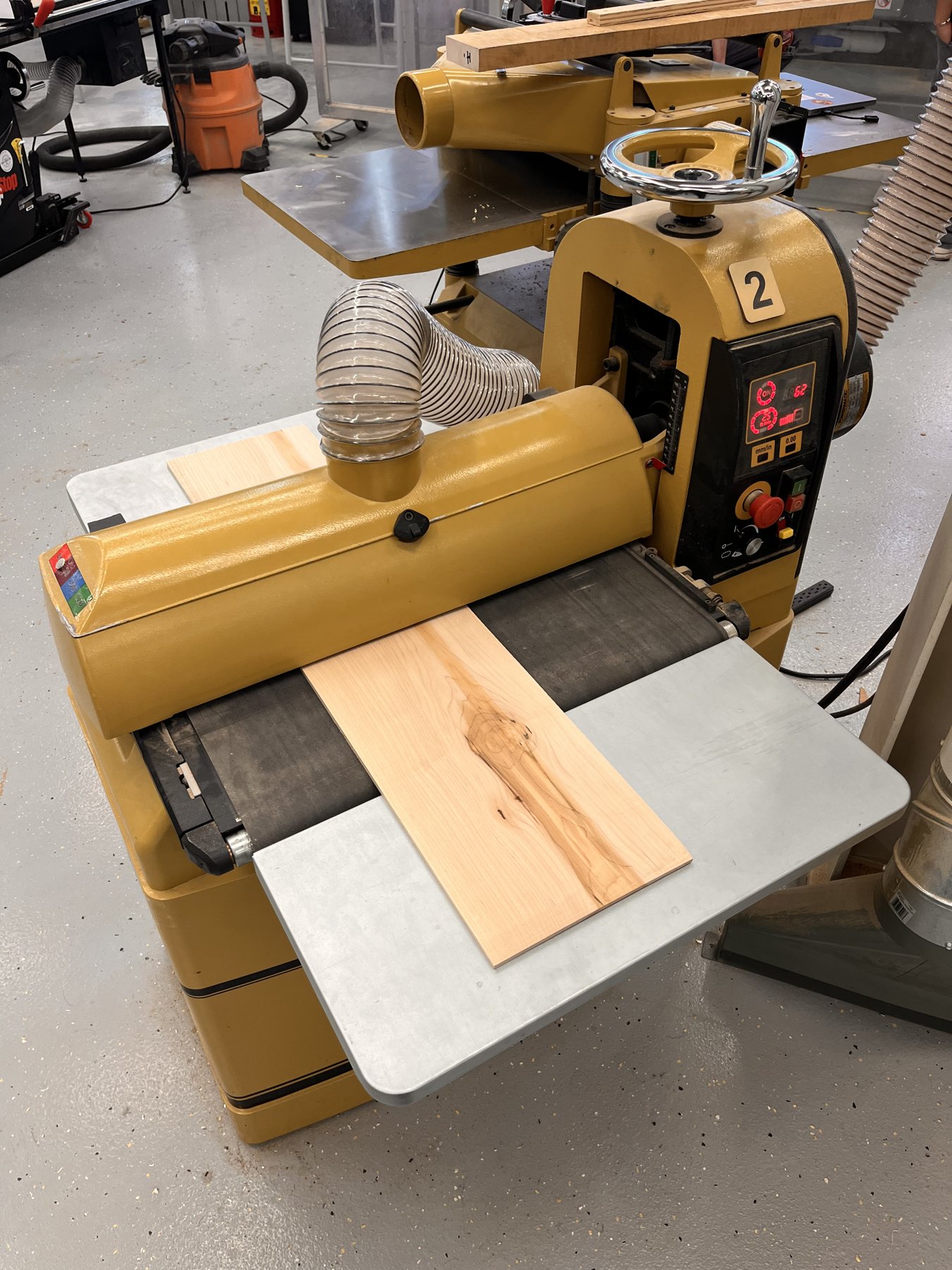 Processing a maple layer through the drum sander