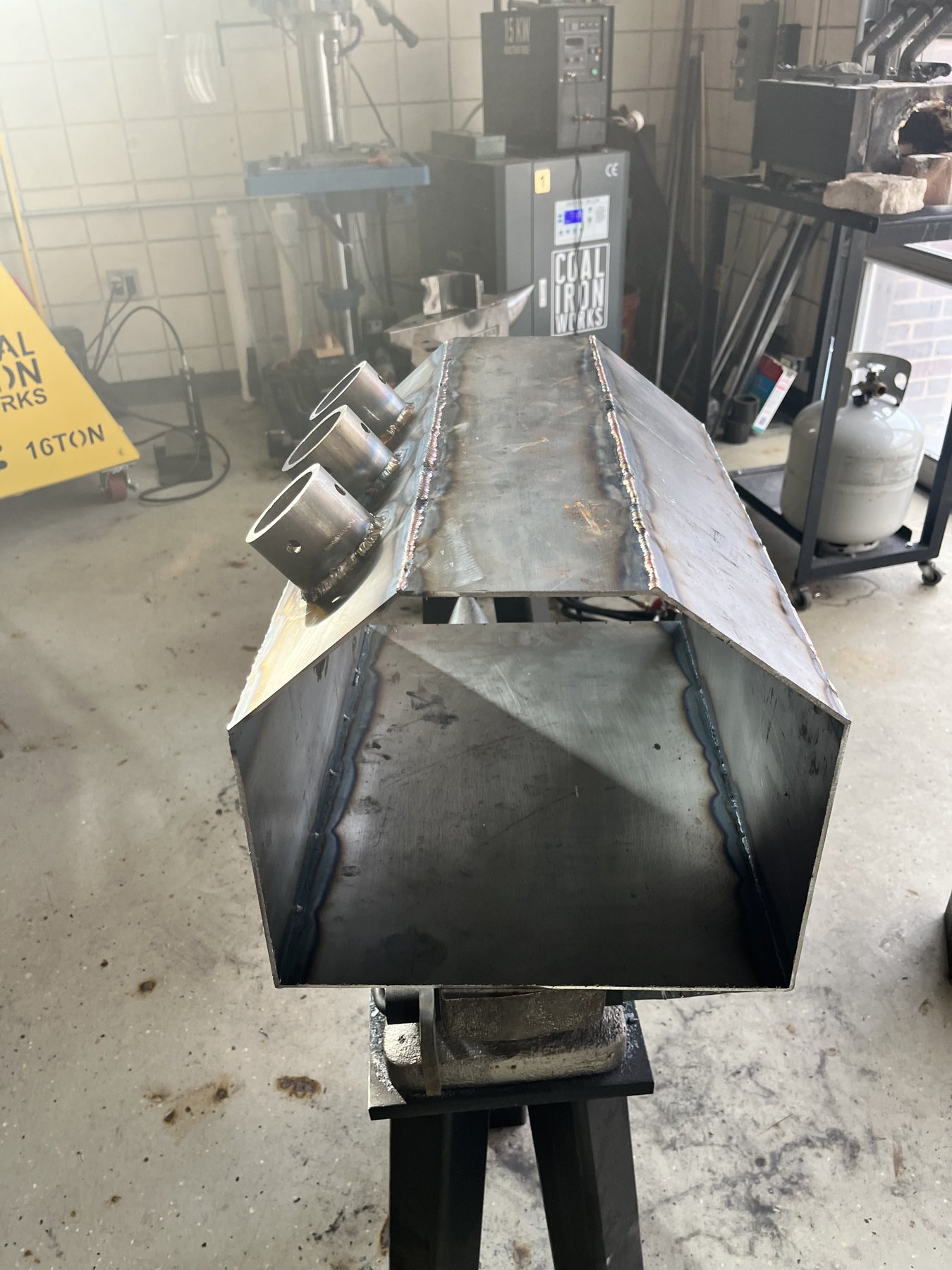 Forge shell and burner openings during construction