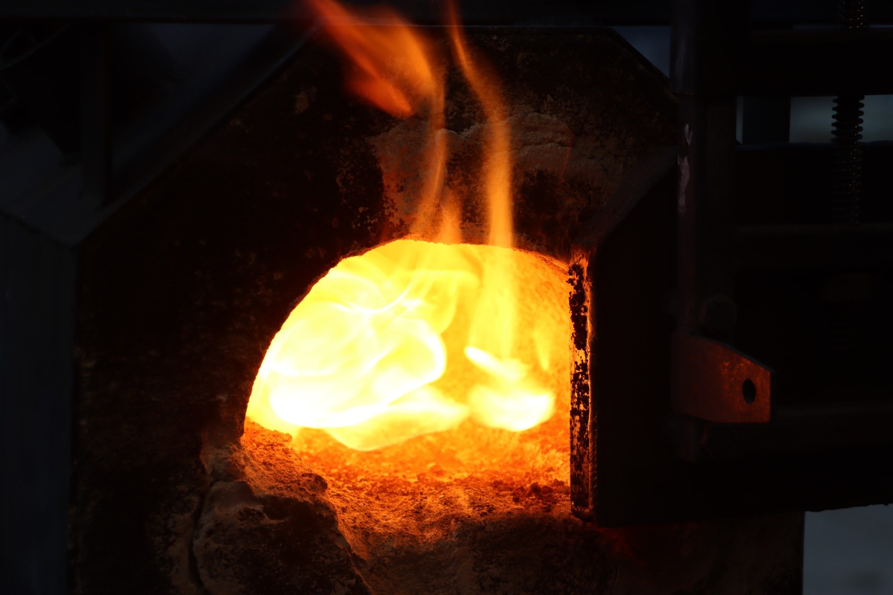 Close view of the heated forge chamber