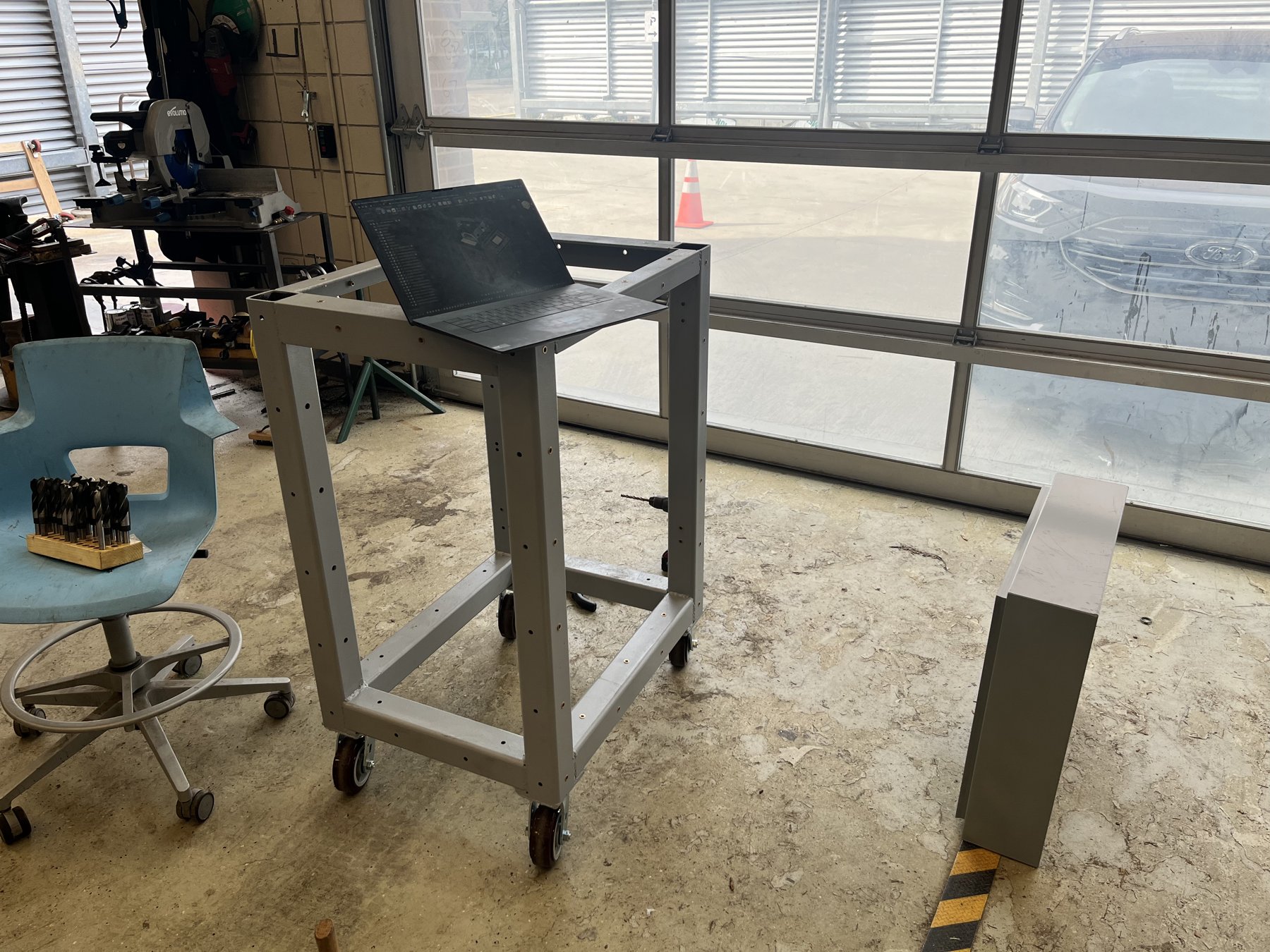 Cart and sheet-metal panels before assembly